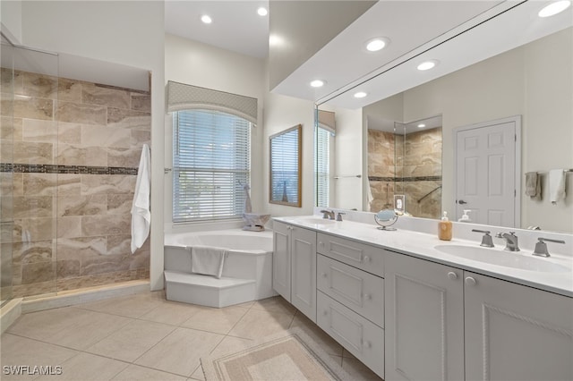 bathroom featuring vanity, tile patterned flooring, and plus walk in shower