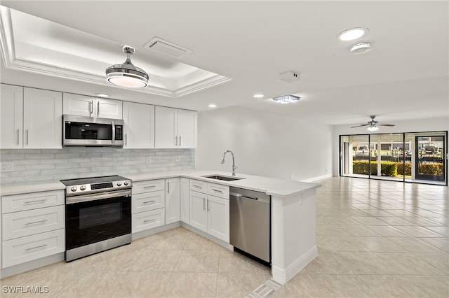 kitchen with white cabinetry, sink, ceiling fan, and stainless steel appliances