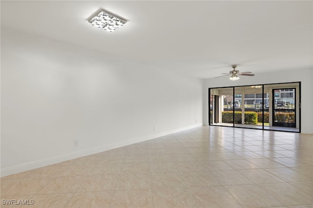 unfurnished room featuring ceiling fan and light tile patterned flooring