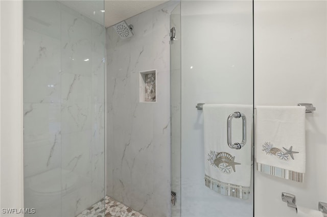 bathroom featuring an enclosed shower