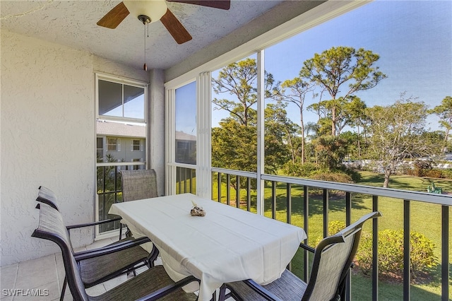 sunroom / solarium with ceiling fan