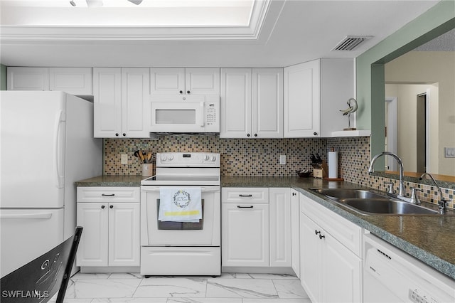 kitchen featuring white cabinets, decorative backsplash, white appliances, and sink