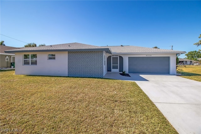 single story home featuring a front yard and a garage