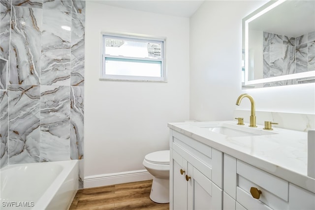 full bathroom featuring shower / bathing tub combination, vanity, toilet, and wood-type flooring