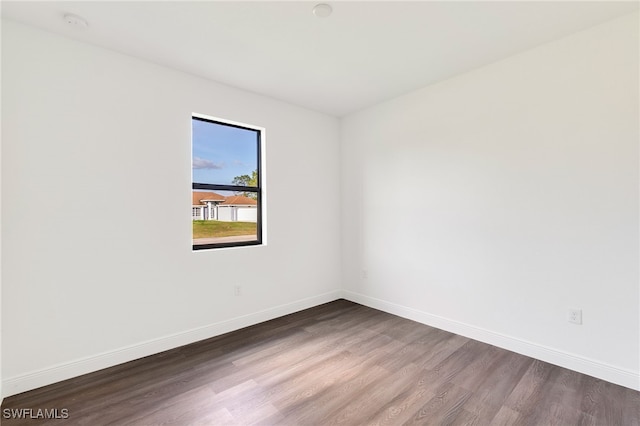 unfurnished room featuring hardwood / wood-style flooring