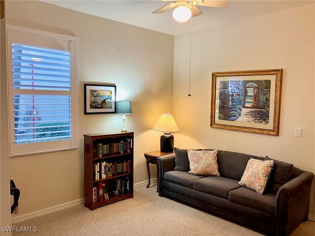 living room with carpet and ceiling fan