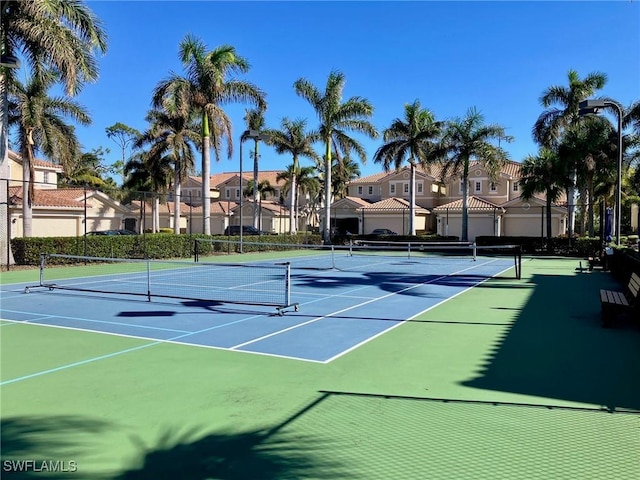 view of sport court with basketball hoop