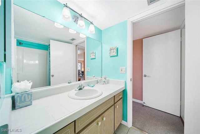 bathroom featuring vanity and walk in shower