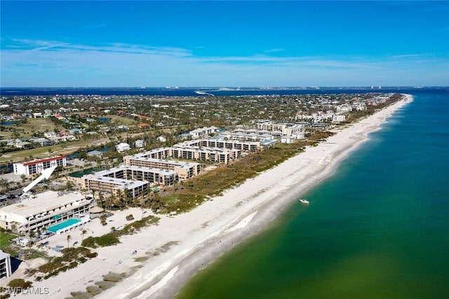 birds eye view of property with a view of the beach and a water view