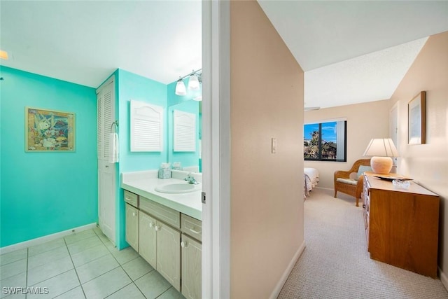 bathroom featuring tile patterned flooring and vanity