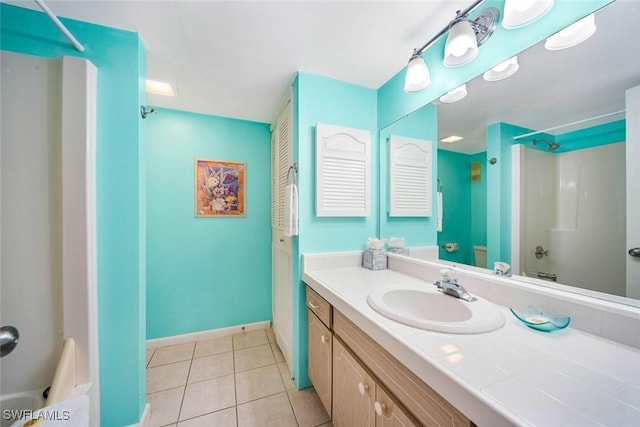 bathroom featuring bathing tub / shower combination, tile patterned flooring, and vanity