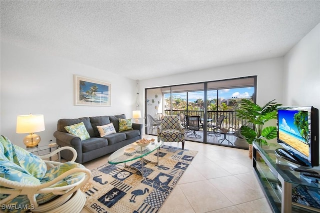 living room featuring light tile patterned floors and a textured ceiling