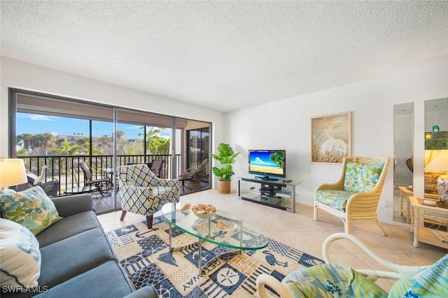 living room featuring light tile patterned floors and a textured ceiling