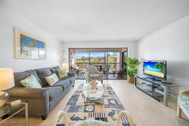 living room with light tile patterned floors and a textured ceiling