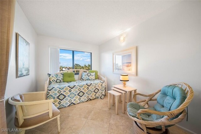 1440 Middle Gulf Dr Unit 2E, Sanibel, FL 33957 - bedroom featuring light tile patterned floors