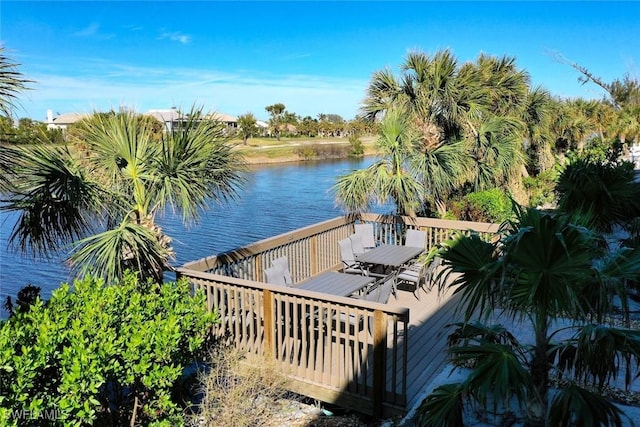 dock area featuring a deck with water view