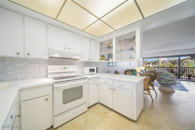 1440 Middle Gulf Dr Unit 2E, Sanibel, FL 33957 - kitchen with white appliances, under cabinet range hood, decorative backsplash, a peninsula, and open shelves