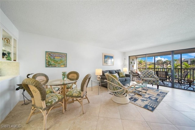 living room featuring light tile patterned floors and a textured ceiling