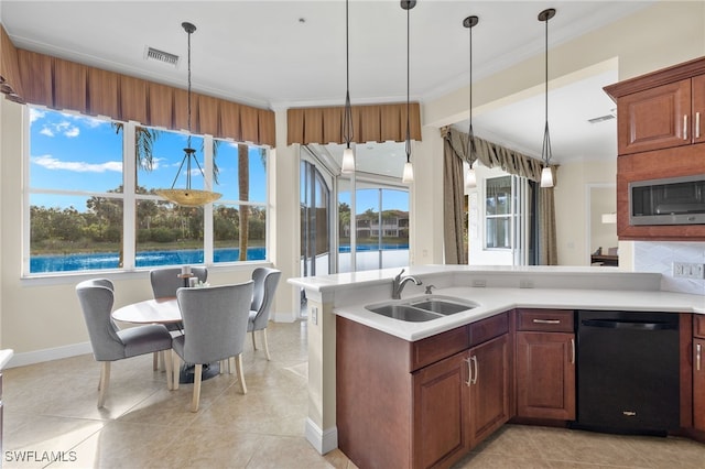 kitchen with sink, pendant lighting, light tile patterned floors, dishwasher, and stainless steel microwave