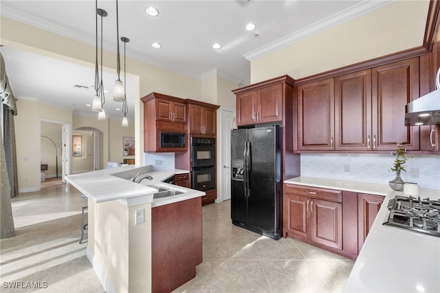 kitchen with decorative backsplash, pendant lighting, crown molding, and black appliances