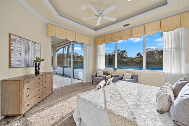 bedroom with ceiling fan, a raised ceiling, light carpet, and access to outside