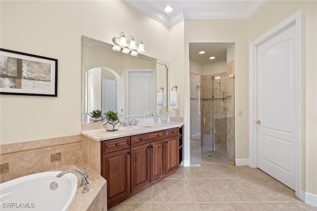 bathroom with tile patterned floors, vanity, ornamental molding, and independent shower and bath