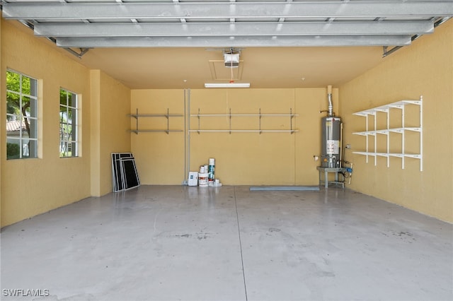 garage with a garage door opener and water heater