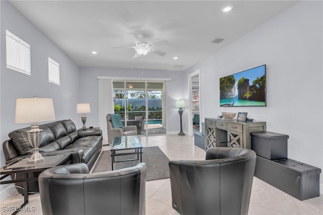 tiled living room with ceiling fan