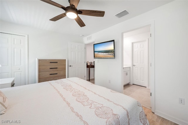 bedroom with light wood-type flooring, a closet, ensuite bath, and ceiling fan