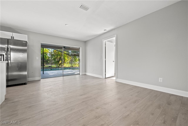 unfurnished living room featuring light hardwood / wood-style floors