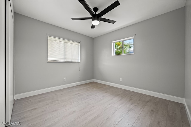 unfurnished room featuring ceiling fan and light wood-type flooring