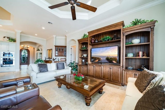 living room featuring ceiling fan and ornamental molding