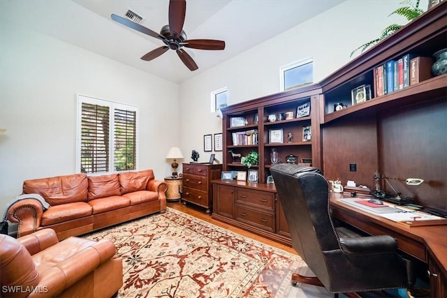 office space with ceiling fan and light wood-type flooring