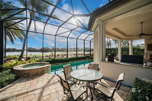 view of patio featuring ceiling fan, a lanai, and a pool with hot tub