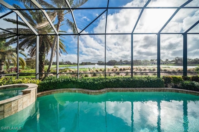 view of swimming pool with glass enclosure and an in ground hot tub