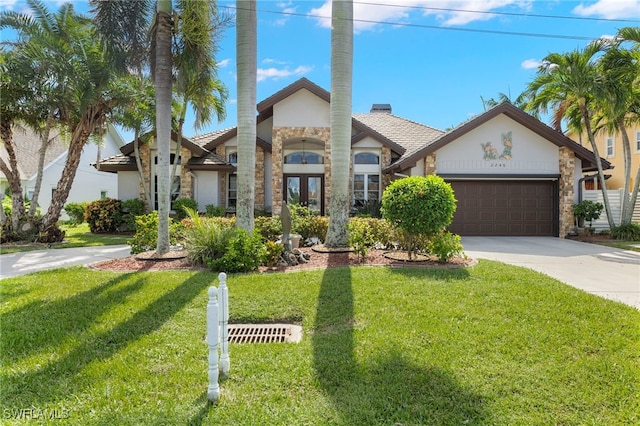 view of front of house featuring a front yard and a garage