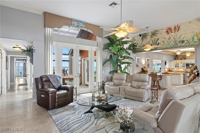 tiled living room with french doors and ceiling fan