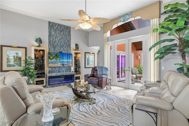 living room with french doors, ceiling fan, and crown molding