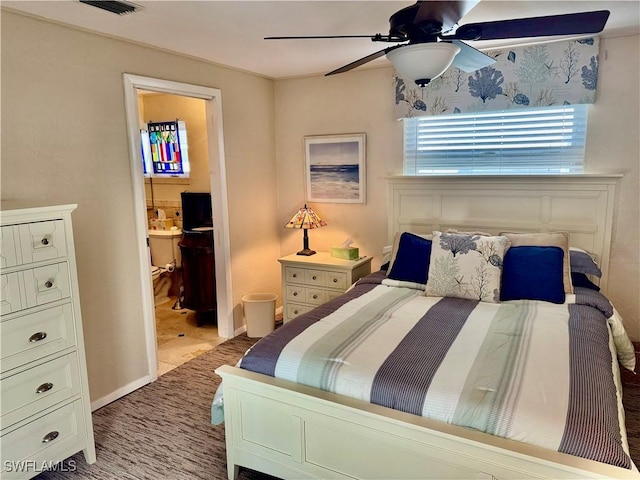 bedroom featuring ceiling fan and ensuite bath