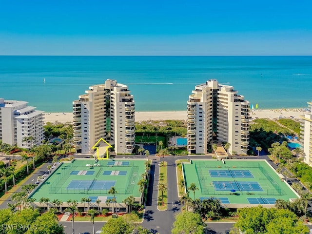 bird's eye view with a water view and a view of the beach