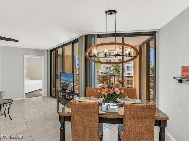 dining area featuring floor to ceiling windows, light tile patterned floors, and an inviting chandelier