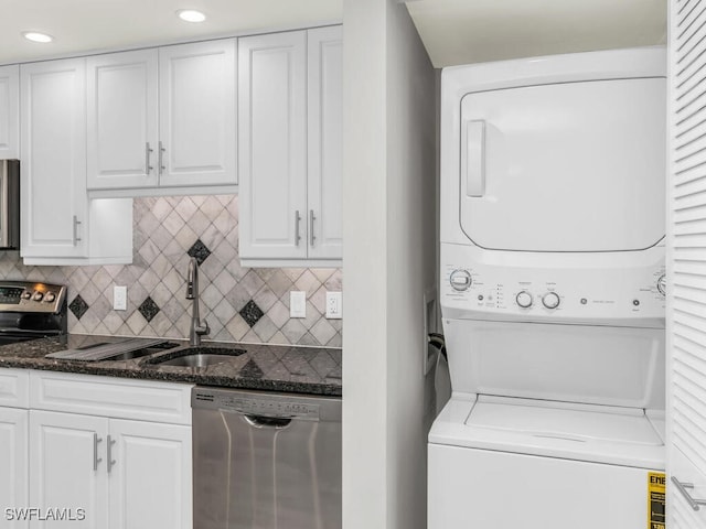 laundry area with stacked washer / dryer and sink