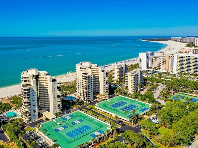 bird's eye view with a water view and a view of the beach