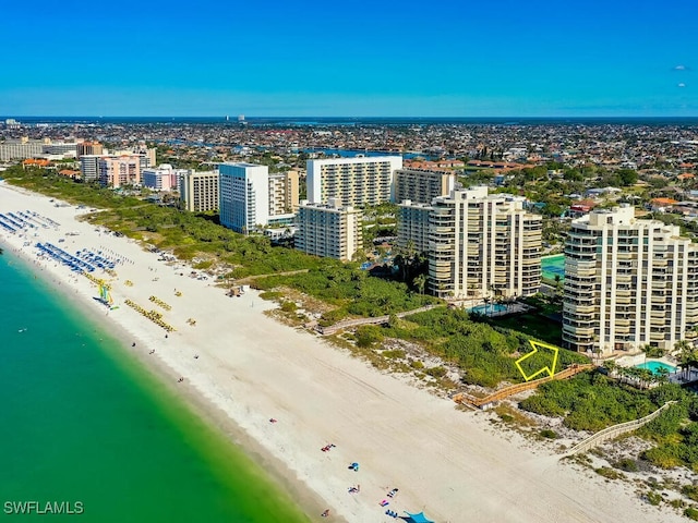 aerial view featuring a view of the beach and a water view