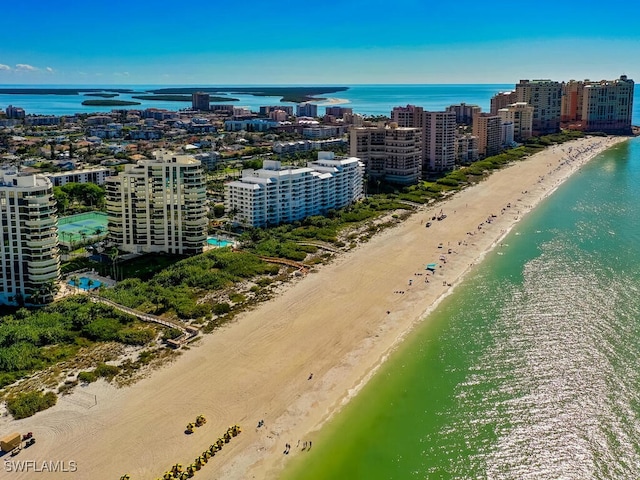 aerial view featuring a water view and a beach view