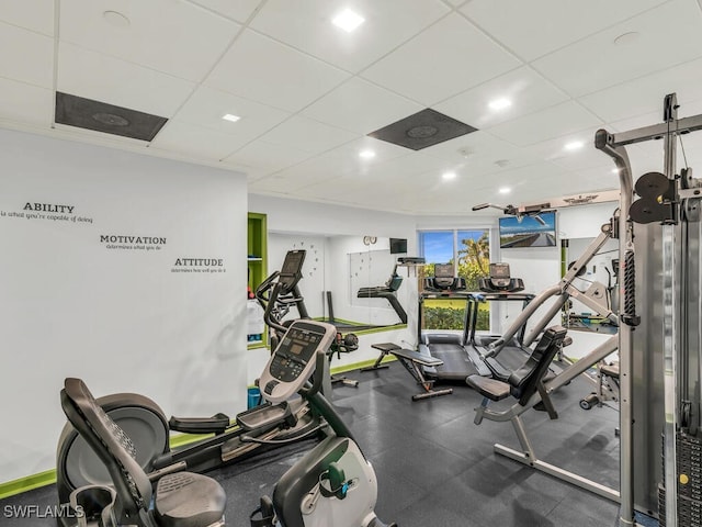 exercise room with a drop ceiling