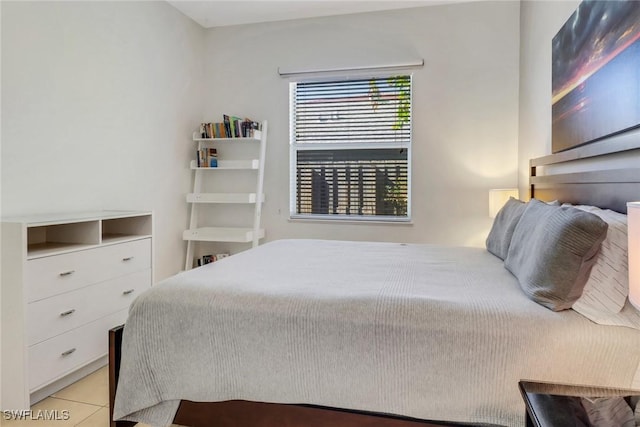 bedroom with light tile patterned floors