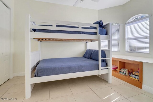 bedroom featuring light tile patterned flooring