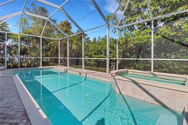 view of pool featuring a patio area and a lanai