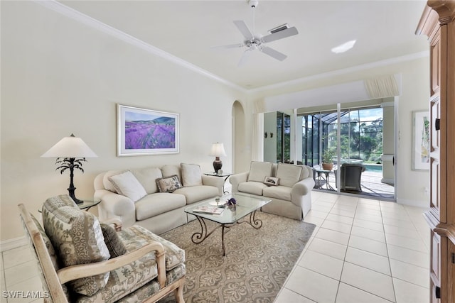 living room with light tile patterned floors, ceiling fan, and ornamental molding